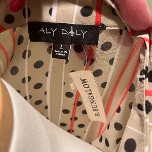 Long sleeve dress with tie neck.